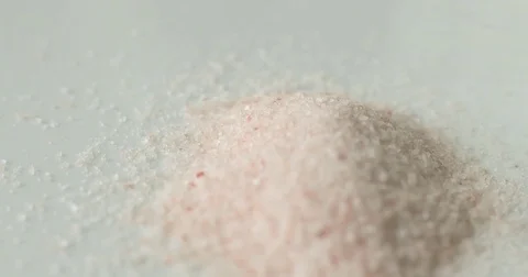 Pink Himalayan salt on a white plate Stock Footage