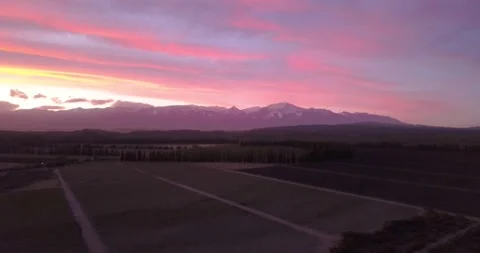 Pink Horizon: A Drone's Capture of the Mountain Sunset Stock Footage 274364232