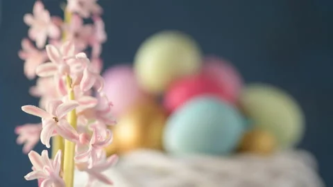 Pink hyacinths in front rotating Easter eggs Stock Footage 148289676
