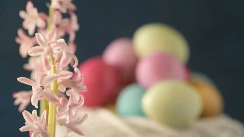 Pink hyacinths in front rotating Easter eggs Stock Footage 148289899