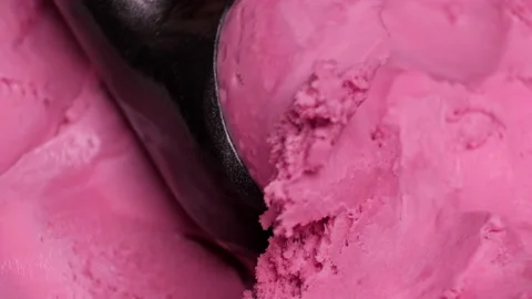 A scoop of pink ice cream in a specializ, Stock Video