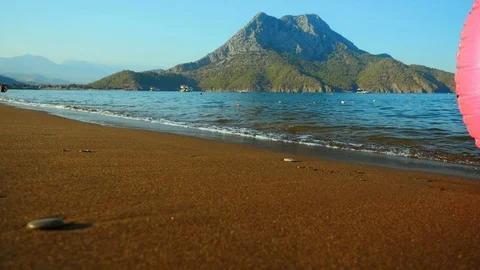 Pink inflatable circle on the beach Stock Footage 97905827