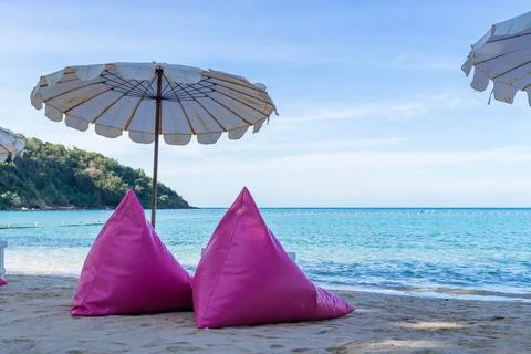 Pink inflatable sofa on the beach. Stock Photos