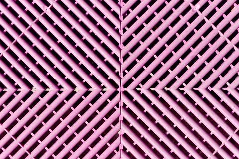 Pink interlocking drainage plastic floor tile pattern Stock Photos