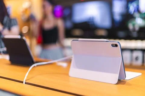 Pink iPad Pro with Magic Keyboard on Retail Display Stock Photos