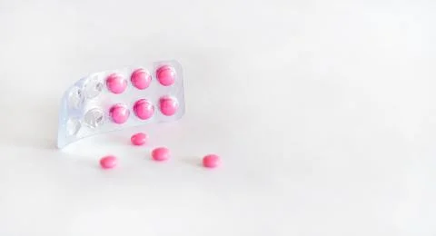 Pink isolated tablets on a white background. Stock Photos