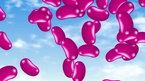 Pink Jelly Bean Candy Falling Against a Blue Sky Background Stock Footage 346114687