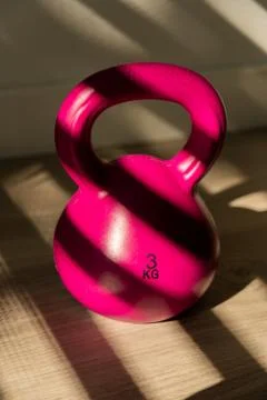 Pink kettlebell with dramatic light Stock Photos