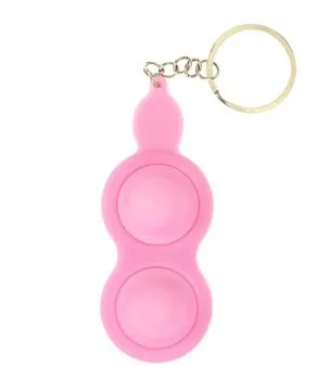 Pink keychain for two simple dimples, pop it. Fashionable and modern anti str Stock Photos