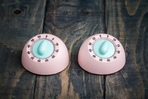 Pink Kitchen Cooking Timer on Blue Background Stock Photos