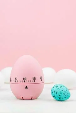 Pink kitchen egg timer on a pink background. cooking time, soon Easter Stock Photos