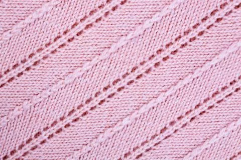 Pink knitted patterned fabric background Stock Photos