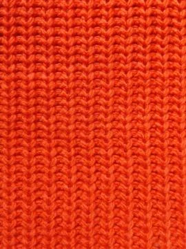 Pink knitted texture background. Pattern of wool knitting for wallpaper and an Stock Photos