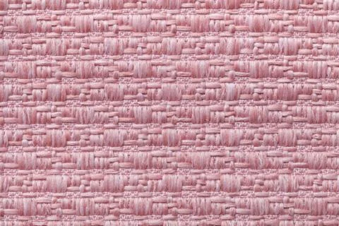 Pink knitted woolen background with a pattern of soft, fleecy cloth. Texture  Foto stock