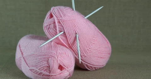 Pink knitting on table. Stock Footage 167983885