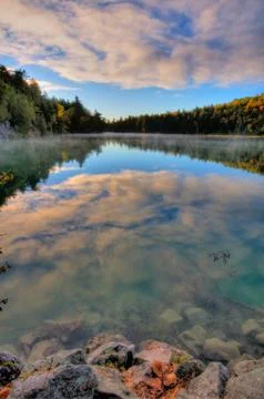 Pink lake cloud reflections Stock Photos