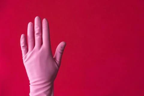 Pink left hand on red Stock Photos