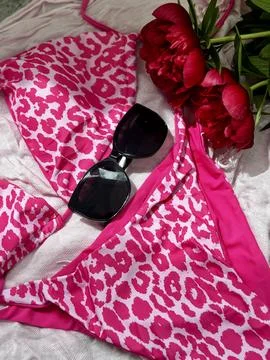 Pink Leopard Print Bikini Set with Sunglasses and Peonies Stock Photos