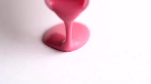  Pink lipgloss pouring on white background. Stock Footage 263190929