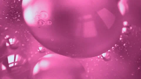 Pink liquid with bubbles Stock Footage 20677462