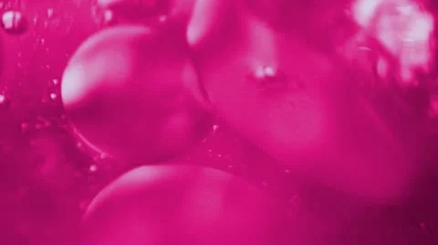 Pink liquid with bubbles Stock Footage 20679390