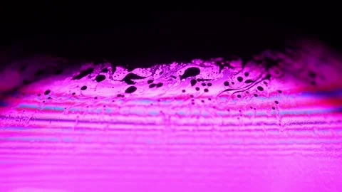 Pink liquid on dark background, bright sphere Stock Footage 291460536