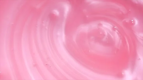 Pink liquid soap background. Pearlescent shower gel swirl texture, surface Stock Footage 342845284