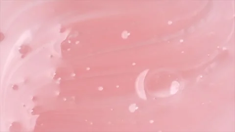 Pink liquid soap background. Pearlescent shower gel swirl texture Stock Footage 344697590