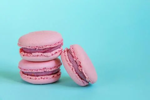 Pink macaron on blue background Stock-Fotos