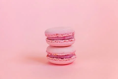 Pink macaron on pink background Stock Photos
