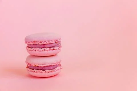 Pink macaron on pink background Stock Photos