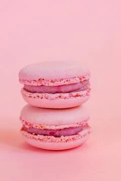 Pink macaron on pink background Stock Photos