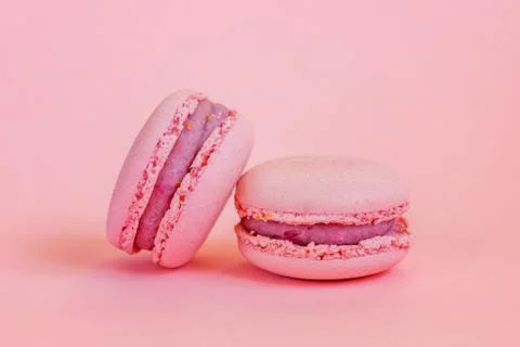 Pink macaron on pink background Stock Photos