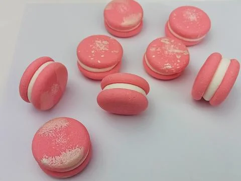 Pink macarons dessert composition on white background Stock Photos