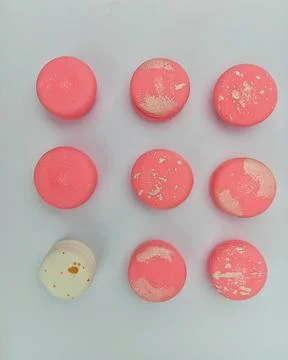 Pink macarons flat lay pattern on white background Stock Photos