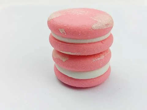 Pink macarons stack isolated on white background Stock Photos