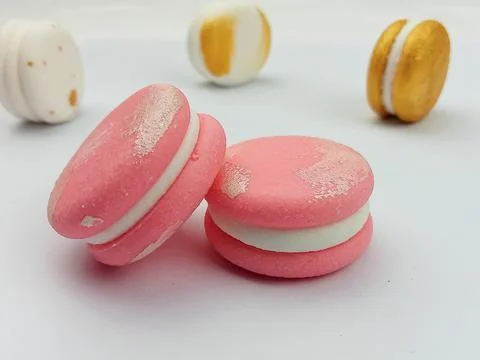 Pink macarons on white background Stock Photos