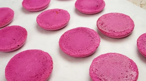 Pink Macaroon shells on baking sheet Stock Footage 62426149