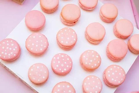 Pink macaroon on a white table horizontal, top view.Candy Bar buffet with Stock Photos
