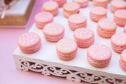 Pink macaroon on a white table horizontal, top view.Candy Bar buffet with Stock Photos