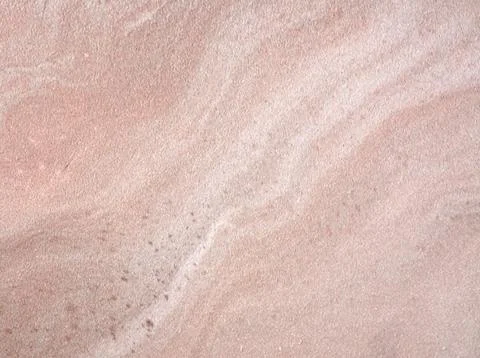 Pink marble, a close-up of the wavy pattern of natural stone with inclusions. Stock Photos