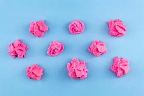 Pink marshmallows on a blue background Stock Photos