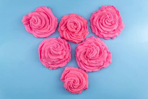 Pink marshmallows on a blue background Stock Photos
