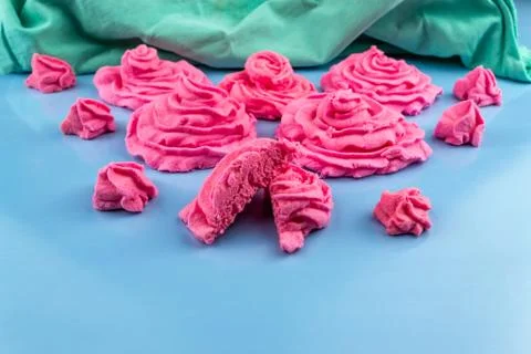 Pink marshmallows on a blue background Stock Photos