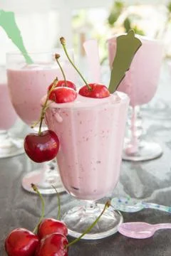 Pink milkshake with cherries Foto stock