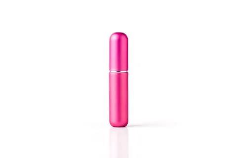 Pink mini perfume atomizer bottle with spray nozzle isolated on white backg.. Stock Photos