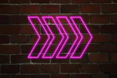 Pink neon arrow-shaped pointer on brick wall Foto stock