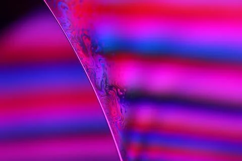 Pink Neon Reflections on Liquid Surface Macro Stock Photos