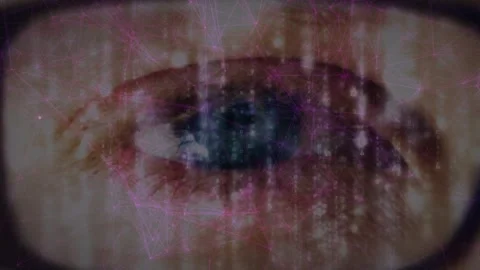 Pink network of connections over close up of a female eye wearing glasses Video stock 326187908