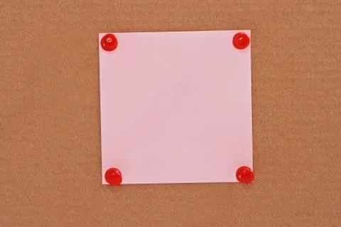 Pink note paper attached with red pins 스톡 사진
